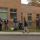 Campaign volunteers wait to hand out materials to voters on Nov. 4, 2014, at Cotswold School in Charlotte, N.C.
Davis Turner/Getty Images